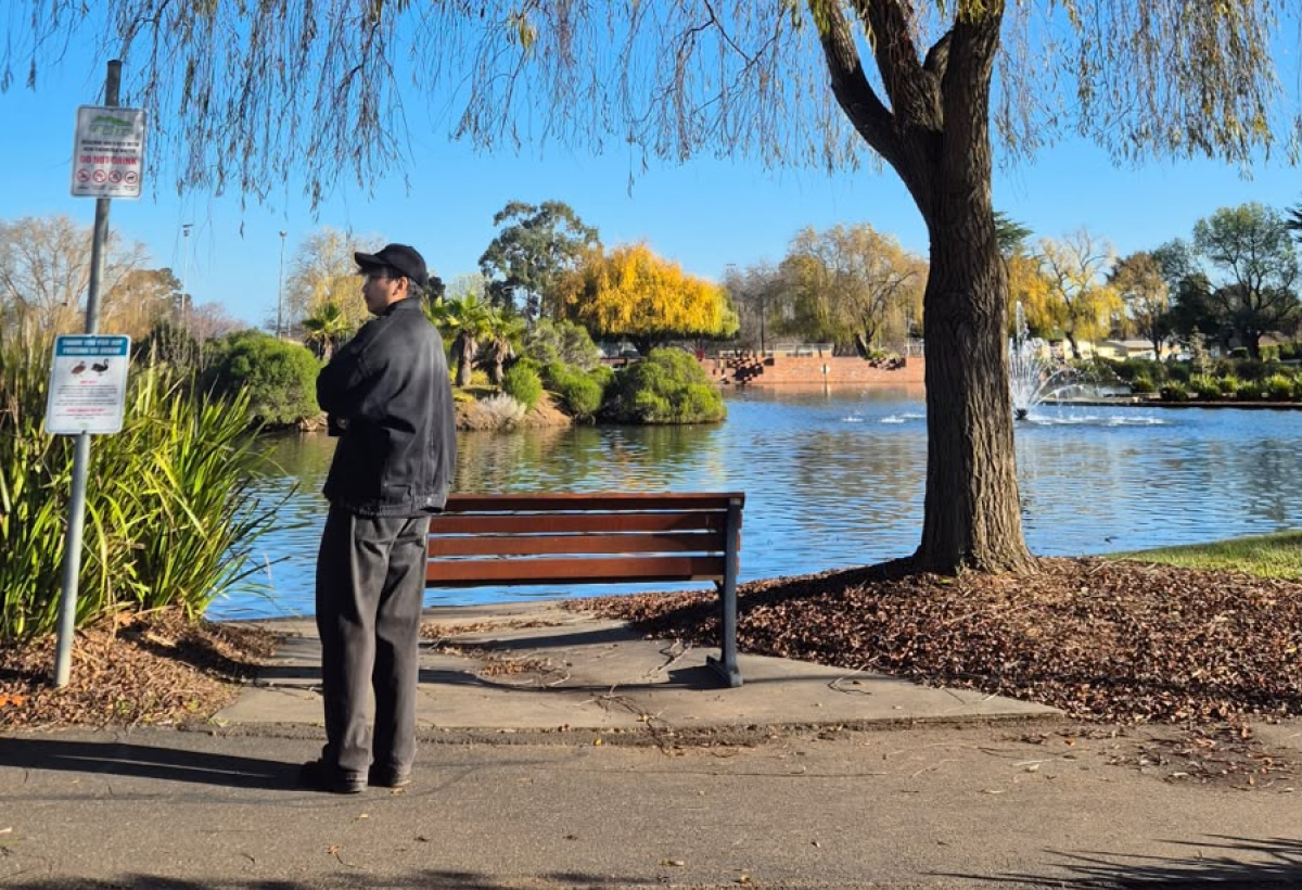 Ben standing beside a lake